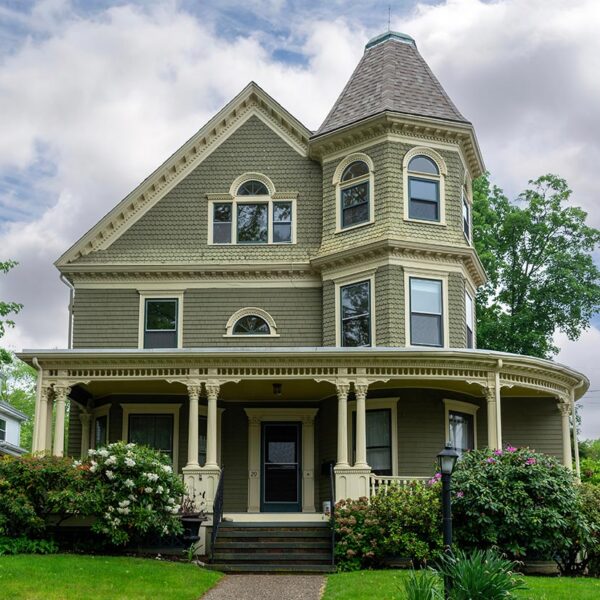 Olive green Queen Anne Victorian with wraparound porch and turret, Northeast Florida Olive green Queen Anne Victorian with wraparound porch and turret, Northeast Florida