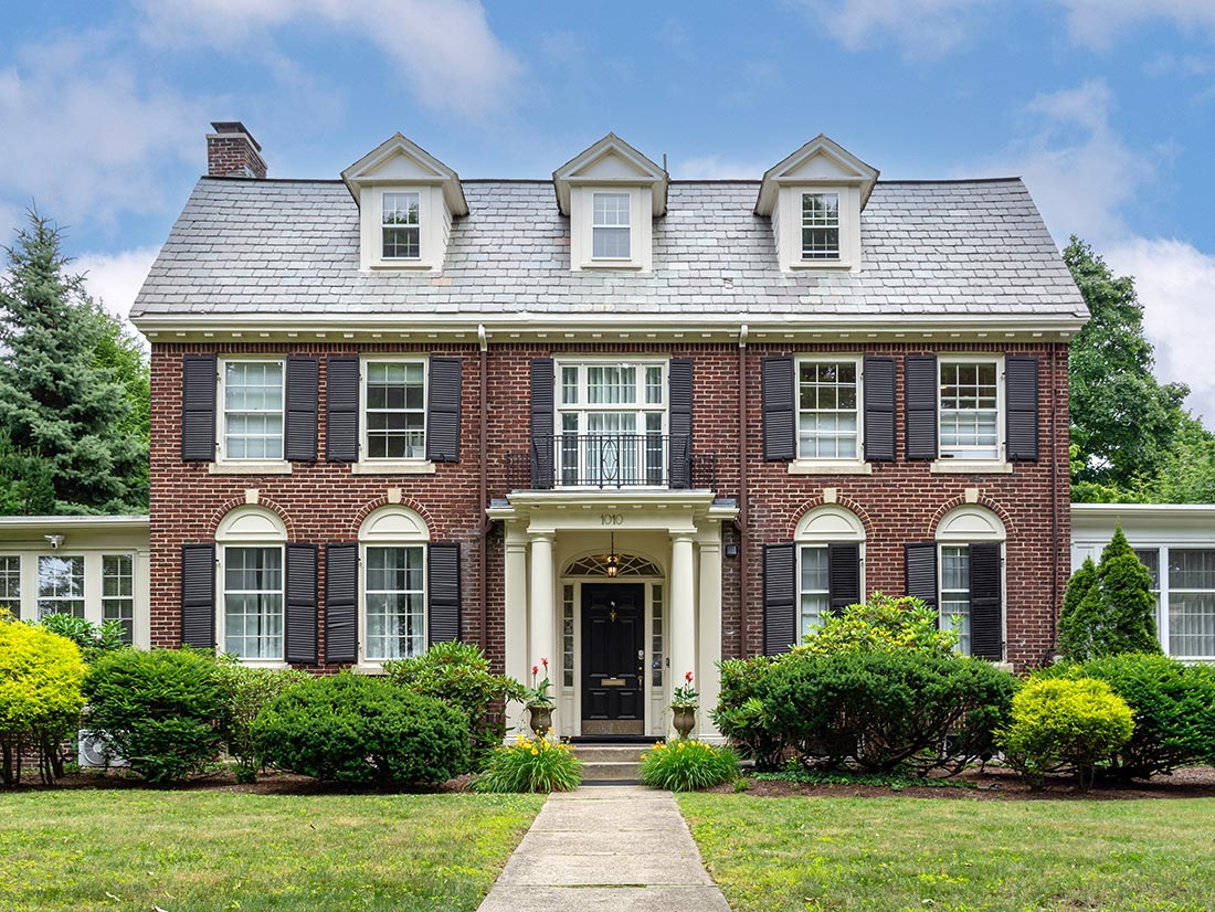 Brick Georgian Colonial with dormers and black shutters, Northeast Florida neighborhoods
