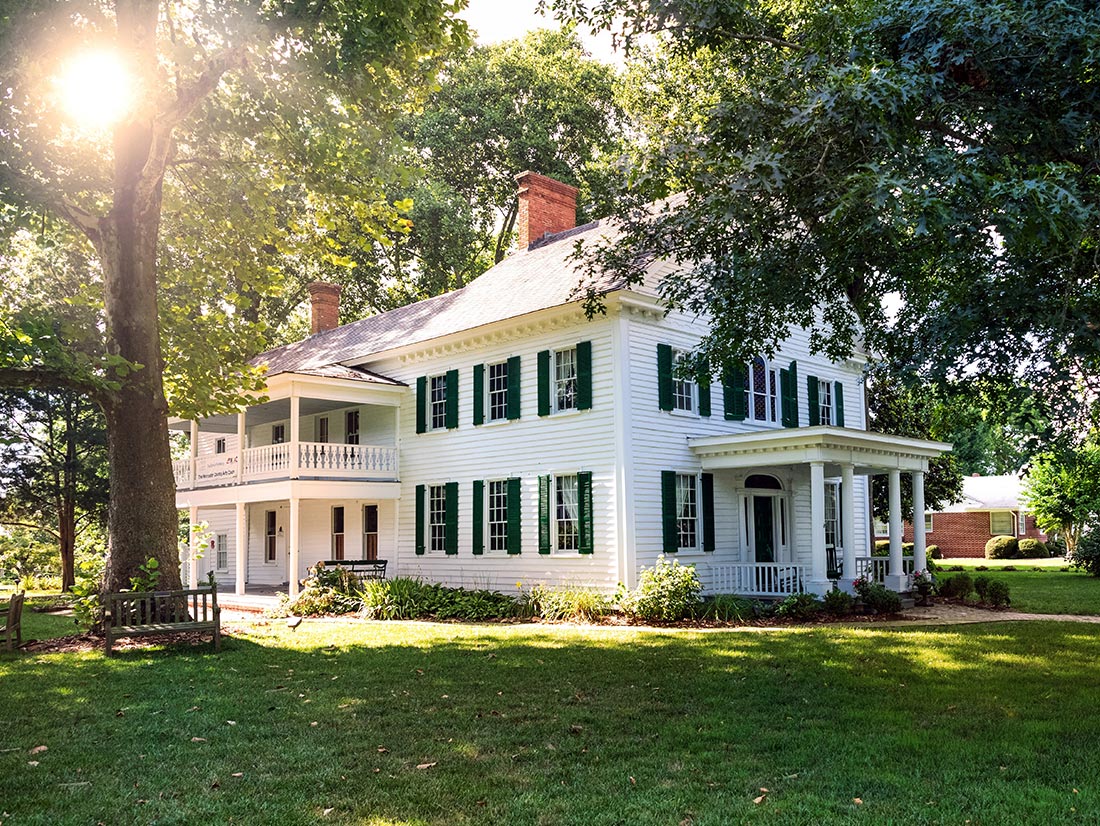 White antebellum-style estate home with two-story porch and green shutters, Northeast Florida White antebellum-style estate home with two-story porch and green shutters, Northeast Florida