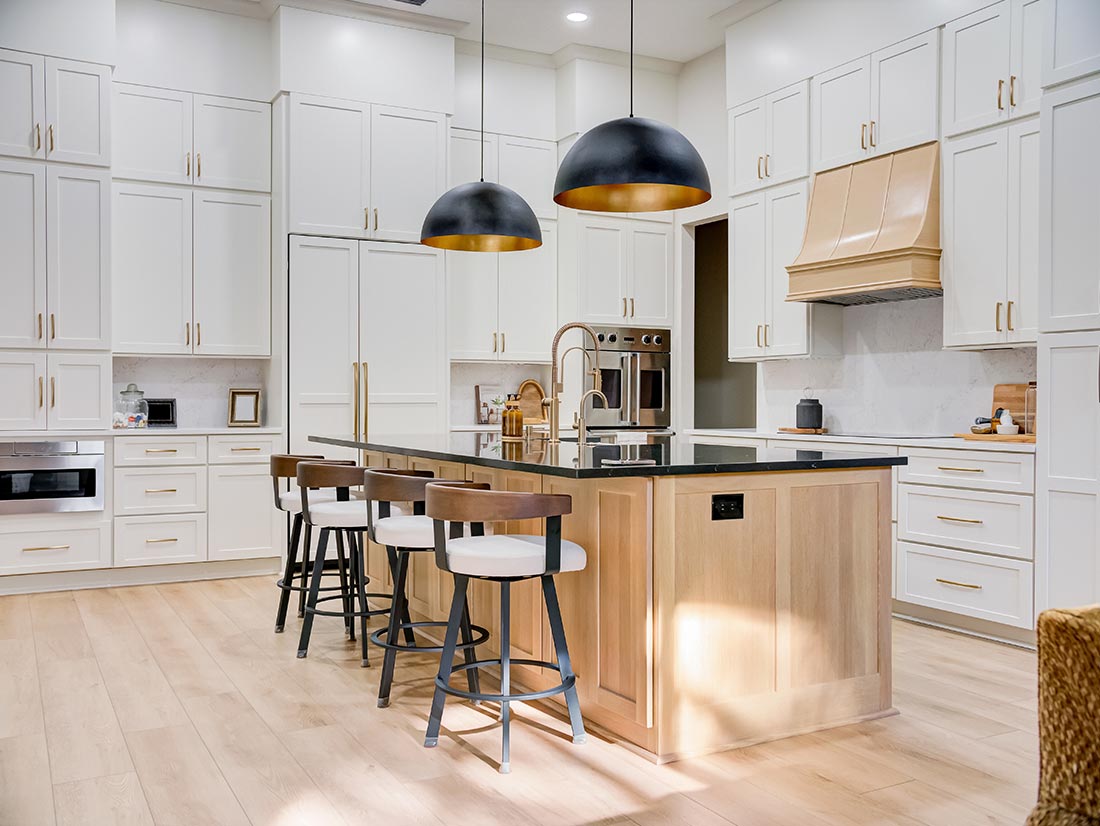 Interior kitchen renovation with white and wood cabinetry and black dome pendants, M&M Homes, Jacksonville Interior kitchen renovation with white and wood cabinetry and black dome pendants, M&M Homes, Jacksonville