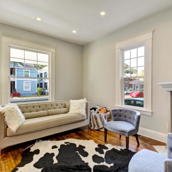 010-living-room-historic-home-remodel Spacious open-concept living room remodel blending modern updates with historic architecture.