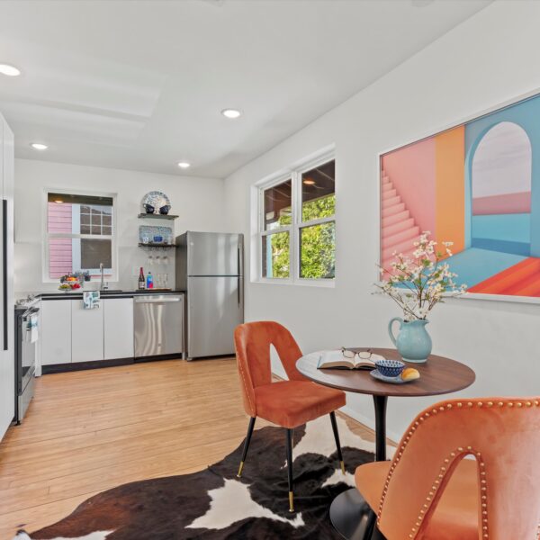 011-open-dining-kitchen-apartment-remodel Open-concept dining area and kitchen renovation optimized for modern urban living spaces.