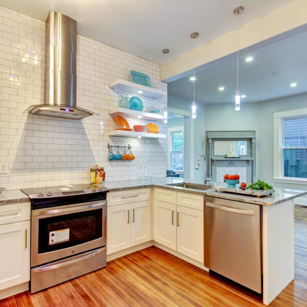 015-modern-kitchen-renovation-jacksonville Bright modern kitchen renovation in Jacksonville FL with premium cabinetry and luxury light fixtures.