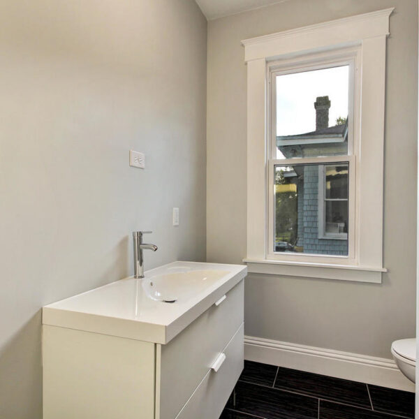 024-guest-bathroom-remodel-jacksonville Updated guest bathroom featuring a modern vanity and professional tile work in Jacksonville.