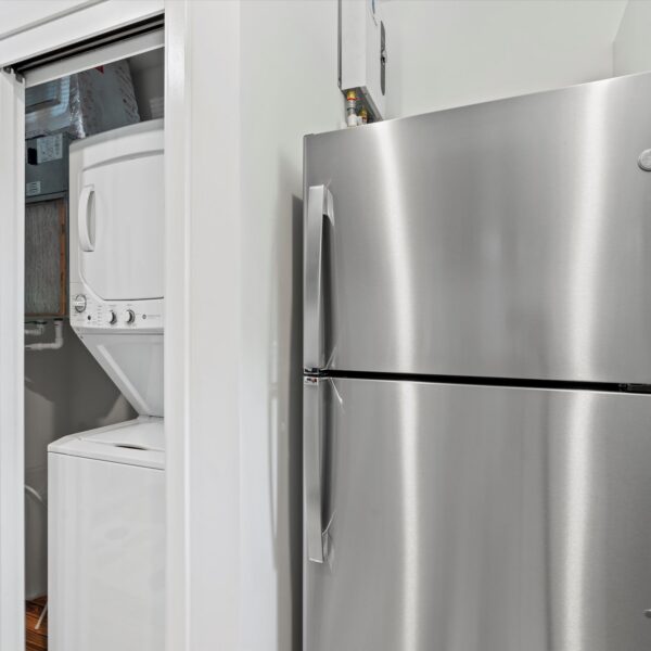 037-functional-apartment-laundry-closet Space-saving residential laundry area remodel by a Jacksonville home renovation company.