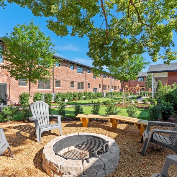 038-restored-apartment-courtyard-exterior Beautifully landscaped exterior courtyard oasis for residents in a historic building.