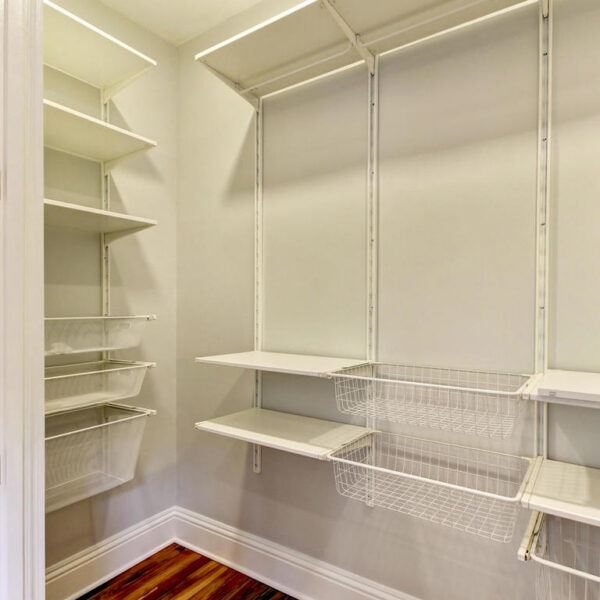 039-walk-in-master-closet-remodel Custom-built walk-in master closet shelving and layout in a renovated historic residence.