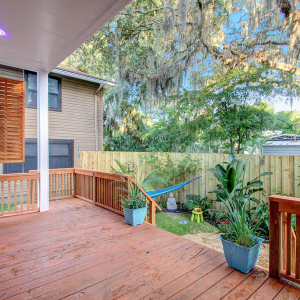 040-custom-deck-jacksonville-historic-renovation Newly constructed backyard wooden deck addition matching the historic exterior style of the home.