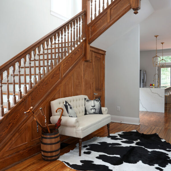 07-classic-colonial-restored-staircase-entry-hall Restored staircase and paneled wainscot anchor the entry hall of this colonial home