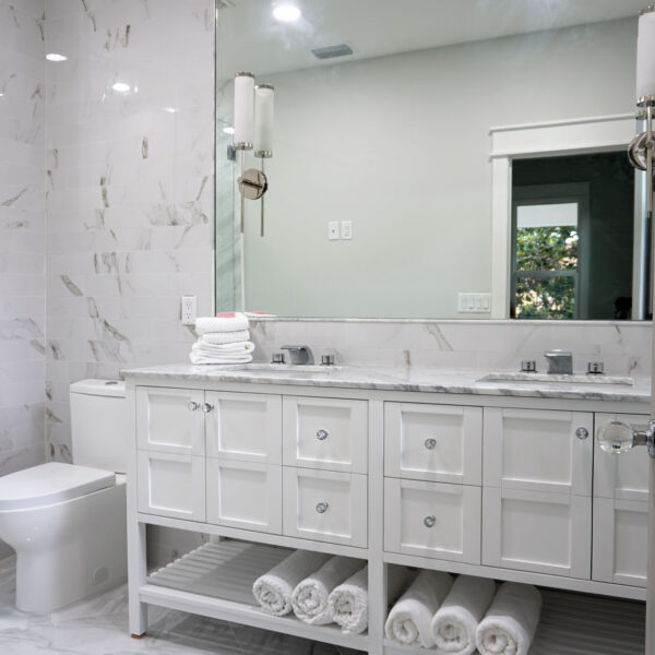 11-classic-colonial-bathroom-double-vanity-marble Full bathroom featuring a double vanity and marble look tile carried up the shower wall