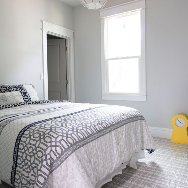 15-classic-colonial-bedroom-writing-desk-nook Second bedroom arranged with a writing desk beside a bright double hung window