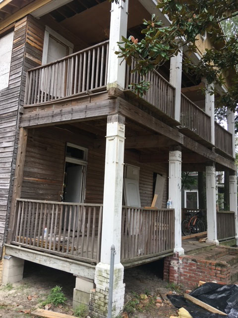 classic-colonial-during-porch-columns-block-pier-supports-jacksonville-mnm-homes-04-04 Structural work in progress: porch columns and framing resting on stacked concrete block supports