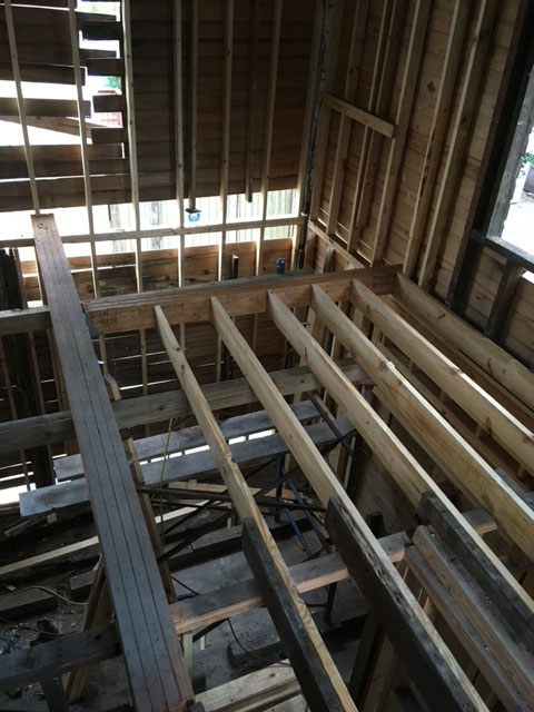 classic-colonial-during-replacement-floor-joist-framing-jacksonville-mnm-homes-04-08 Structural work in progress: new floor joists installed across the opening beside older framing