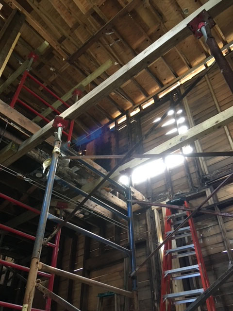 classic-colonial-during-steel-shoring-posts-scaffolding-jacksonville-mnm-homes-04-05 Structural work in progress: steel shoring posts and scaffolding bracing the floor framing overhead