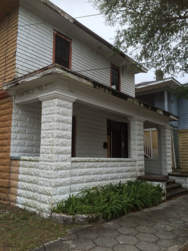 fireplace-house-before-weathered-front-porch-exterior-jacksonville-mnm-homes-01-01 Before renovation: front porch with rusticated block piers and peeling paint on the shingled upper story