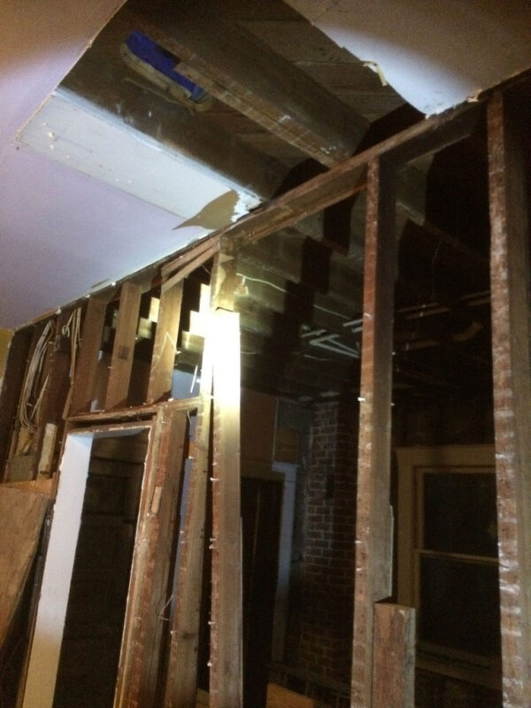 fireplace-house-during-opened-ceiling-wall-framing-jacksonville-mnm-homes-01-05 Work in progress: interior with ceiling and wall finishes removed exposing old framing and wiring