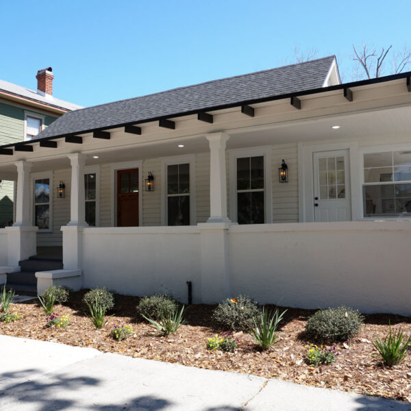 modern-farmhouse-restored-front-porch-jacksonville-mnm-homes-02 Front elevation of a restored 1935 bungalow showing its full width porch columns and wood front door