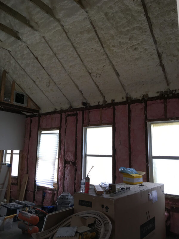 shotgun-house-before-ceiling-framing-and-insulation-jacksonville-mnm-homes-03-03 Before renovation: sloped ceiling and wall framing filled with new insulation around untrimmed windows
