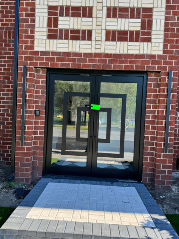 zen-garden-after-restored-entry-glass-doors-jacksonville-mnm-homes-05-16 After renovation: new glass entry doors with keypad access and a paver walkway set in patterned brickwork
