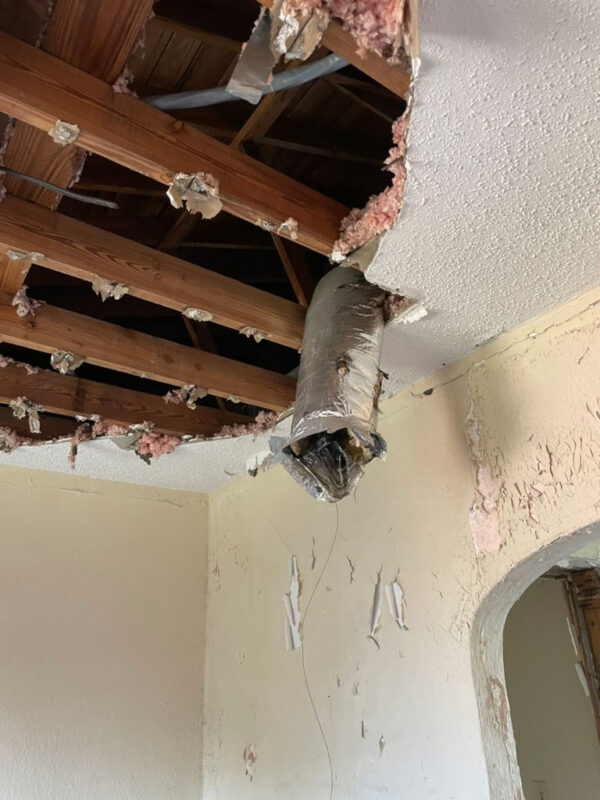 zen-garden-during-opened-ceiling-exposed-joists-jacksonville-mnm-homes-05-06 Work in progress: ceiling partly removed to expose wood joists insulation and a loose flexible duct